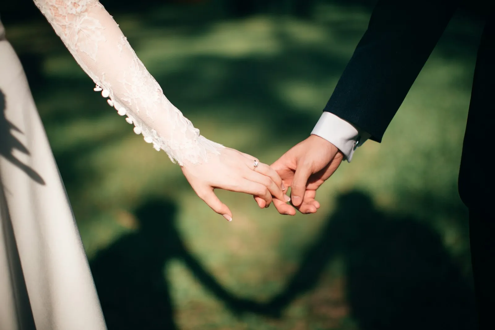 Wedding rings on linen with soft florals